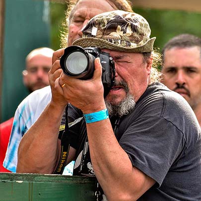 Brian Sullivan photographing at a festival